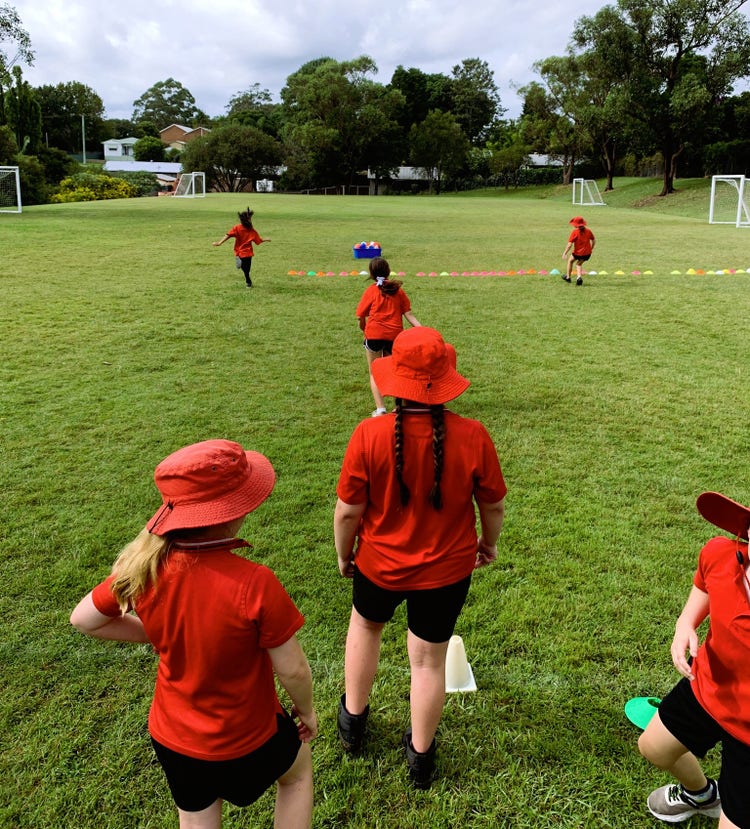 Students running on school oval